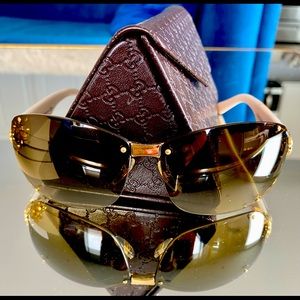 Gucci woman’s aviator and rhinestone sunglasses